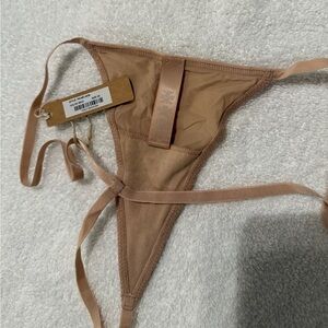 SKIMS T String Thong Panty. Size 2X color is “MICA”. neutral/tan NWT